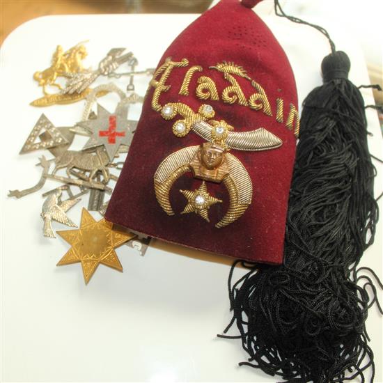 Collection of masonic badges incl hat and books